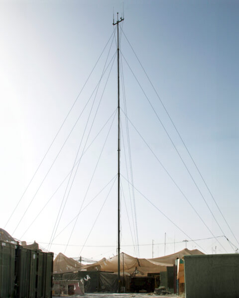 EXL telescopic mast extended at a forward operating base, secured with guy ropes